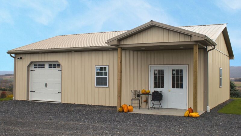 601-30′ x 40′ Beige Pole Building with Carriage Door and Reverse A Porch 30x40 beige pole barn with clay roof and trim, carriage style door, double entry door, windows, and reverse A porch