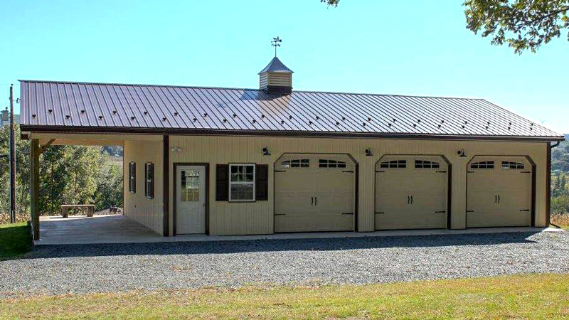 3 garage door with  porch light brown building