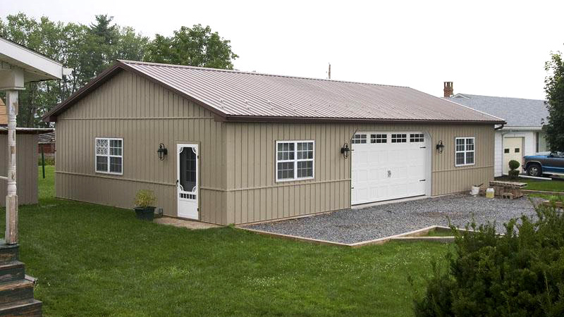 single wide garage door on mid brown building