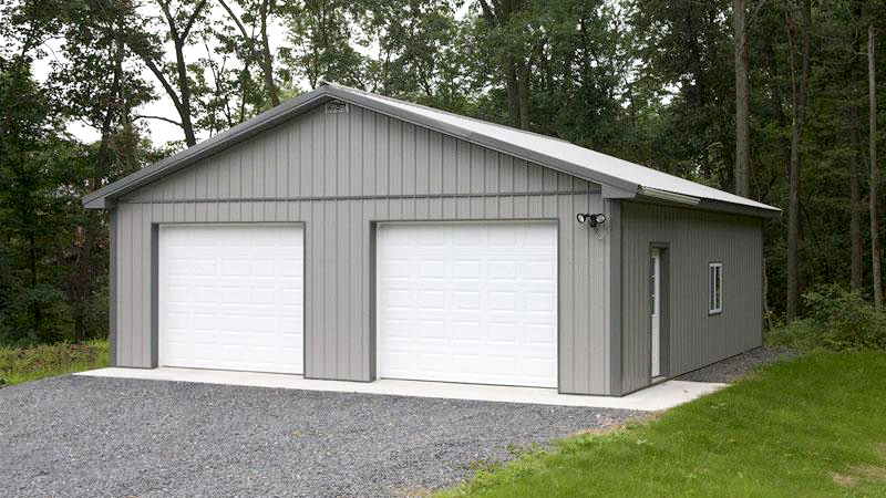 two garage door gray building with white roof