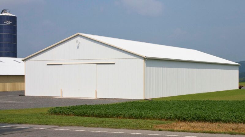 Agricultural Pole Barn 70x152 with split sliding doors and white metal siding