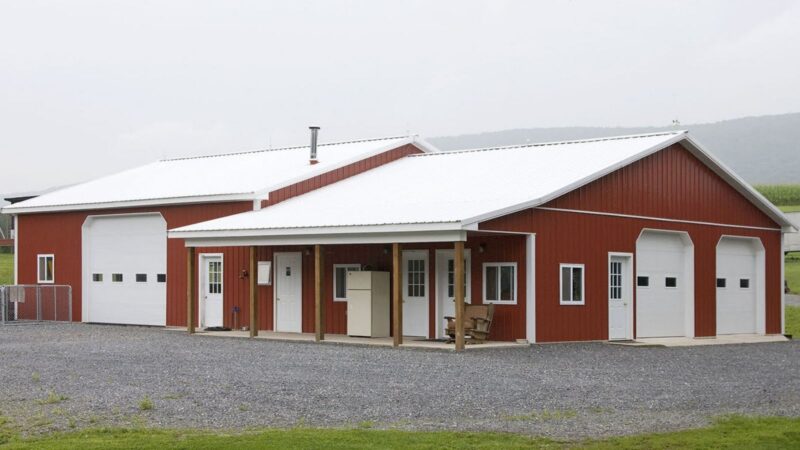 40′ x 72′ combination storage and office pole building with porch and red-and-white color scheme