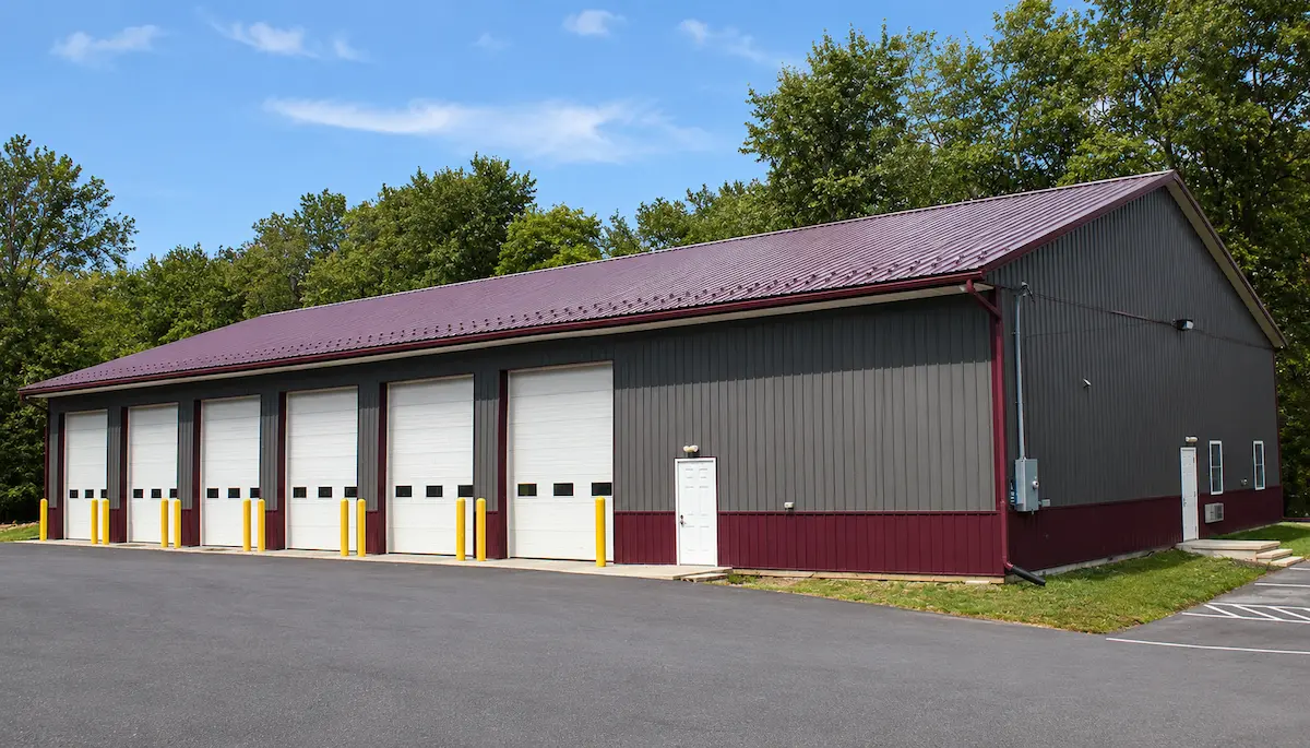 60x120 Charcoal Agricultural Equipment Barn with Burgundy Roof and White Soffit