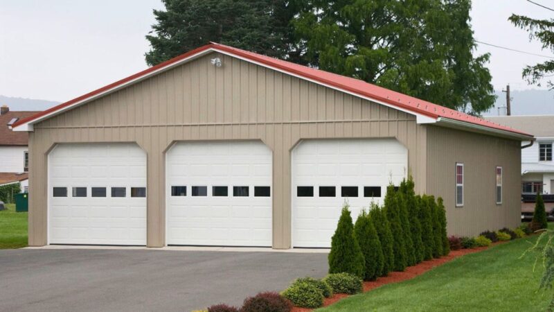 122-Residential Pole Building – 36x40 Clay Siding with Red Roof 36x40 residential pole building with clay walls red roof insulated garage doors and white soffit trim