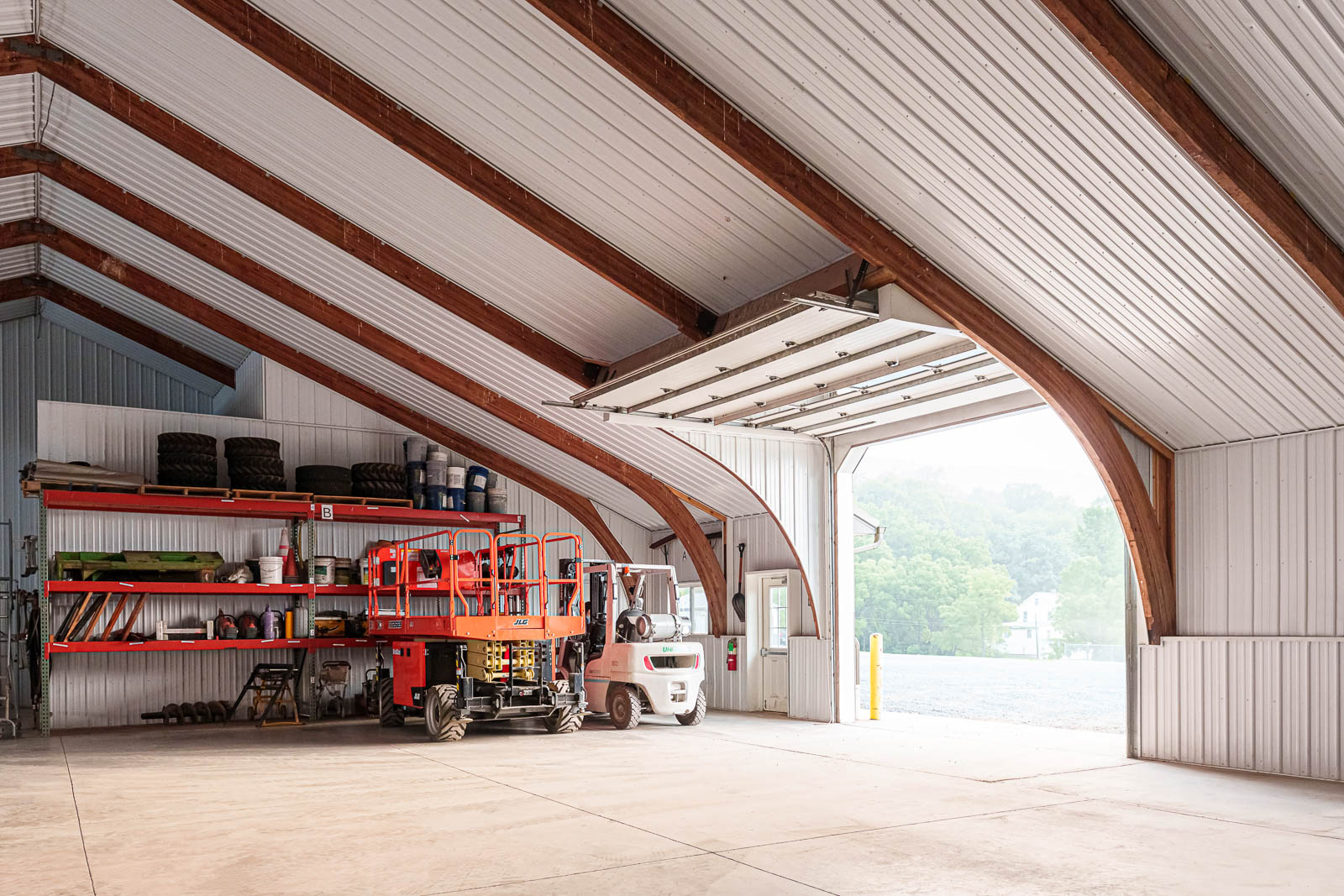 warehouse with lift and open garage door