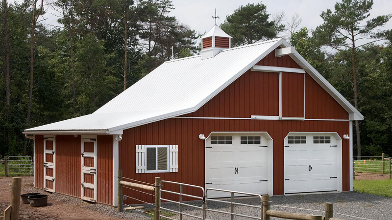 red two garage pole building with white roof