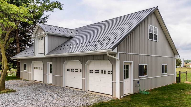 beige carriage house and horse barn building