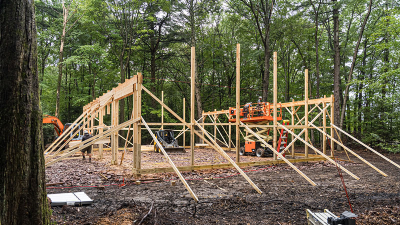 building under construction in the woods