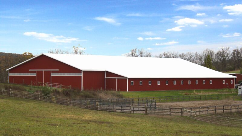 80x200 Red Agricultural Pole Barn with White Roof and Enclosed Lean-To