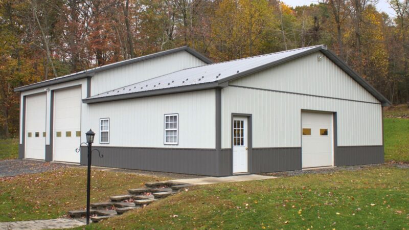 306-40x60 Ag Pole Barn with 3 Garage Doors & Snow Guards 40x60 Bone White Agricultural Pole Barn with Charcoal Roof and Wainscoting