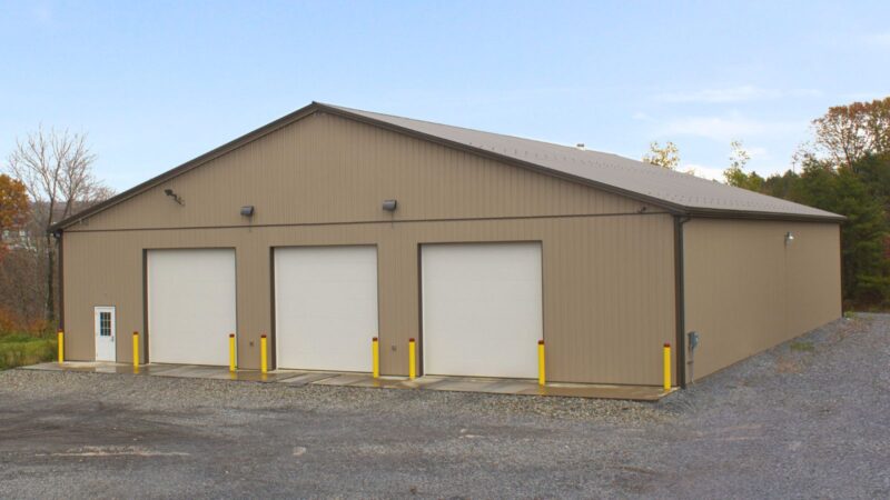 80x100 Clay Agricultural Building with Bronze Roof, 6 Garage Doors, and Snow Guards