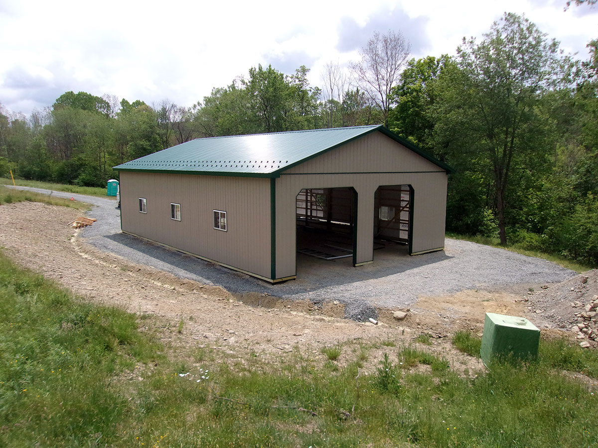 two garage door pole building under construction