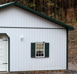 white building with green trim and 12" gables