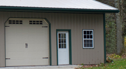 building with carriage door and green trim with 36 cantilever option