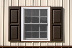 window with brown shutters and trim