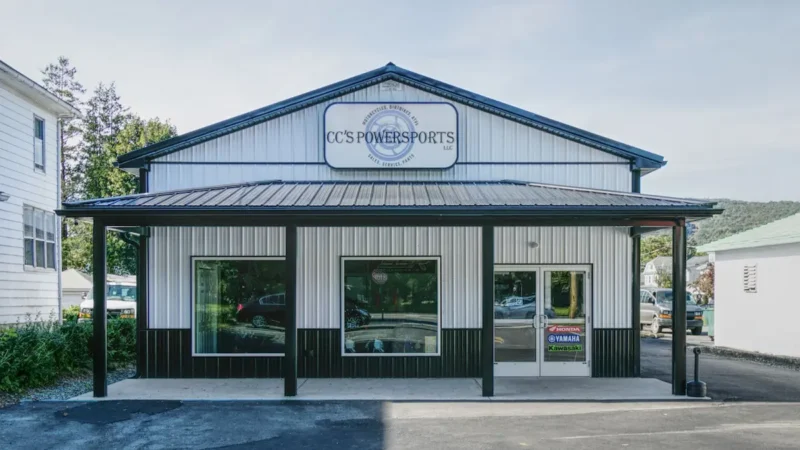 401-40x72x12 Pole Building 50x70 farm shop building exterior with large overhead doors and post-frame construction