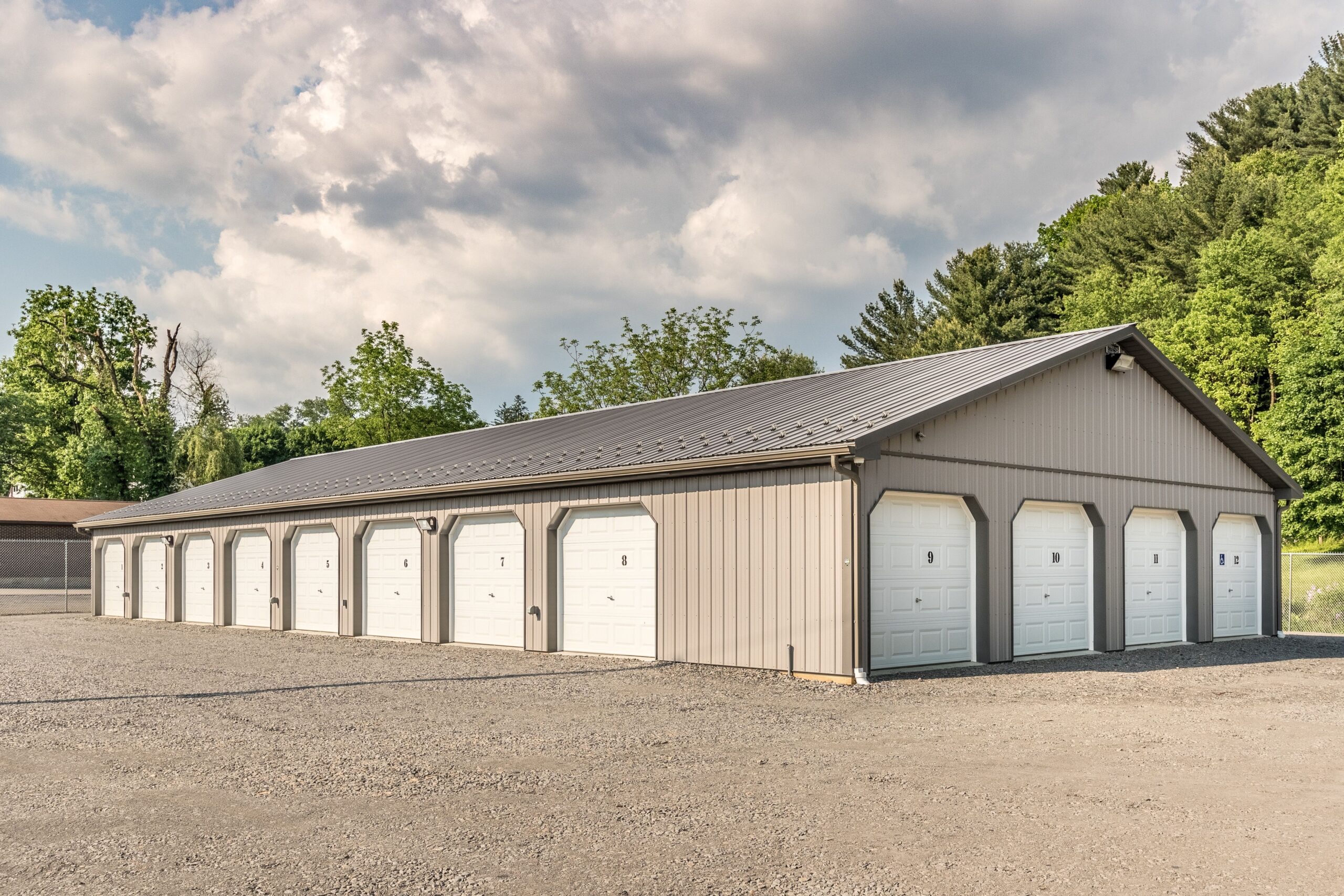 40x90 Pole Building with 20 Partitioned Storage Bays and Insulated Garage Doors Pole building with 20 partitioned storage units, insulated garage doors, and steel ceiling liner panels