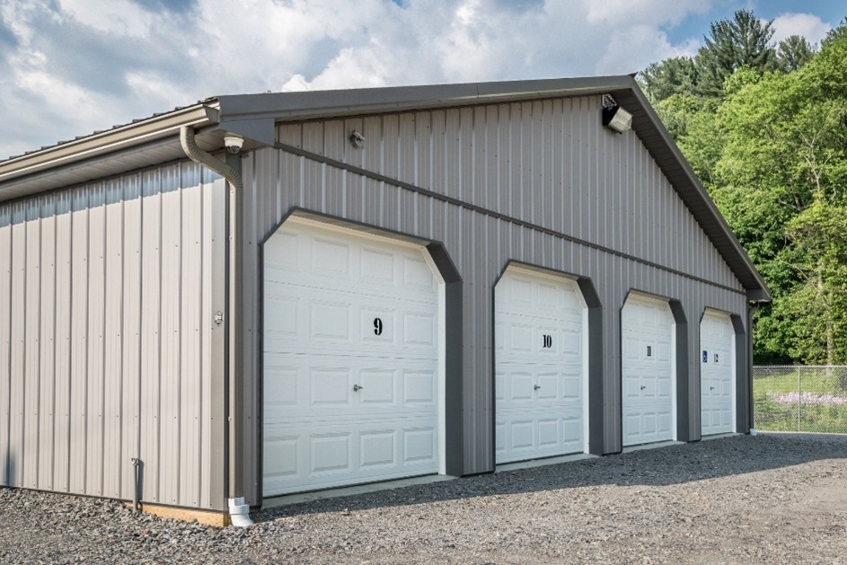 Commercial Storage Pole Building with Gutters Commercial storage pole building with seamless rain gutters and multiple overhead doors