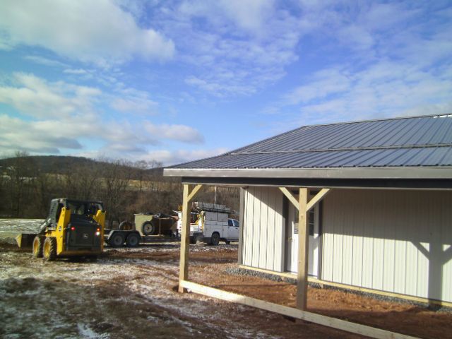 Blue Timberline Buildings pole barn completed during winter under a clear Pennsylvania sky.