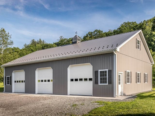 Completed post-frame building with overhead doors