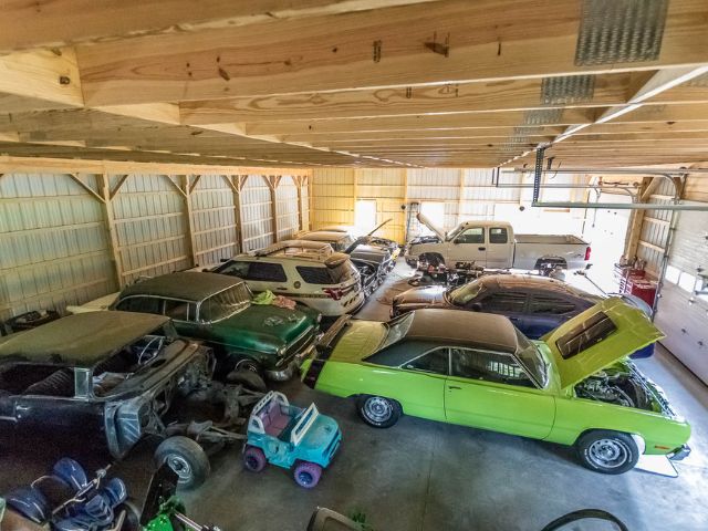Finished pole barn interior used for classic car and equipment storage