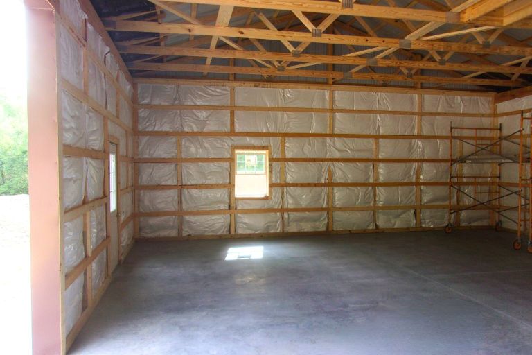 Post-frame building insulation system with air sealing and condensation control