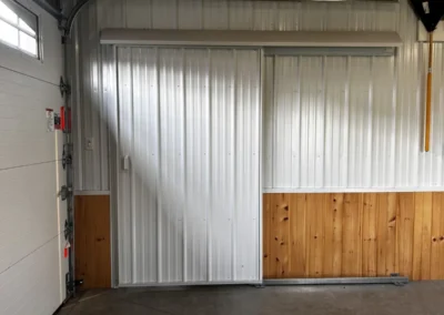 Interior sliding door inside a pole building by Timberline Buildings