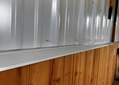 Interior wood paneling and trim in a pole building