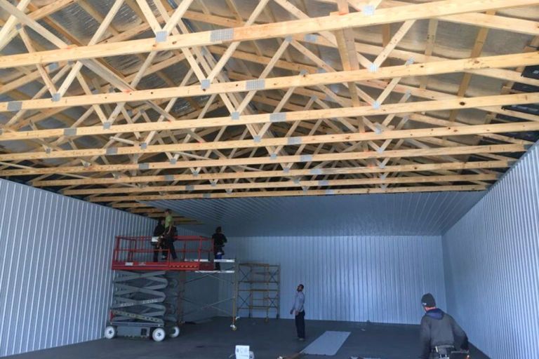 Post-frame building interior under construction