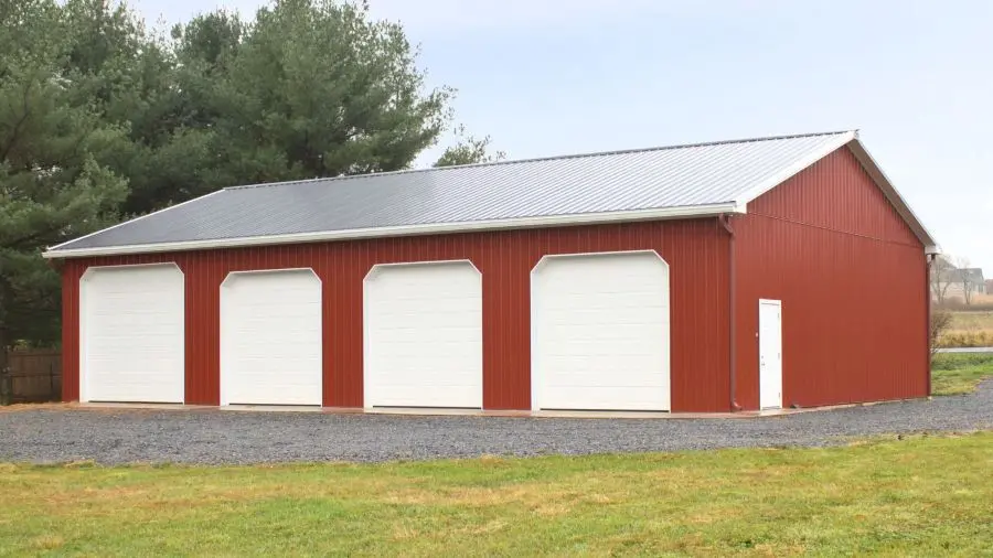 Proper Door Width and Height for Farm Equipment Storage Large overhead doors on farm pole barn allowing tractor and truck access