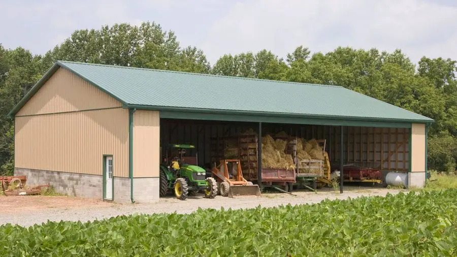 Open-Sided vs Fully Enclosed Farm Equipment Storage Buildings-135 Open-sided agricultural pole barn used for farm equipment storage with partial weather protection