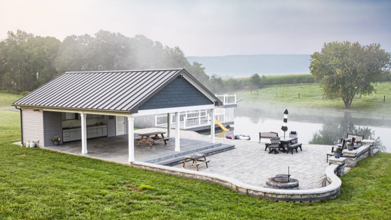 618-Backyard Pavilion Pole Building with Covered Patio by Lake backyard pavilion pole building with covered patio seating and outdoor living space by a lake