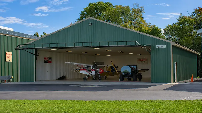 Post-frame aircraft hangar designed for small planes and airfield operations