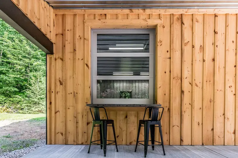 Custom residential pole barn window upgrade with black trim