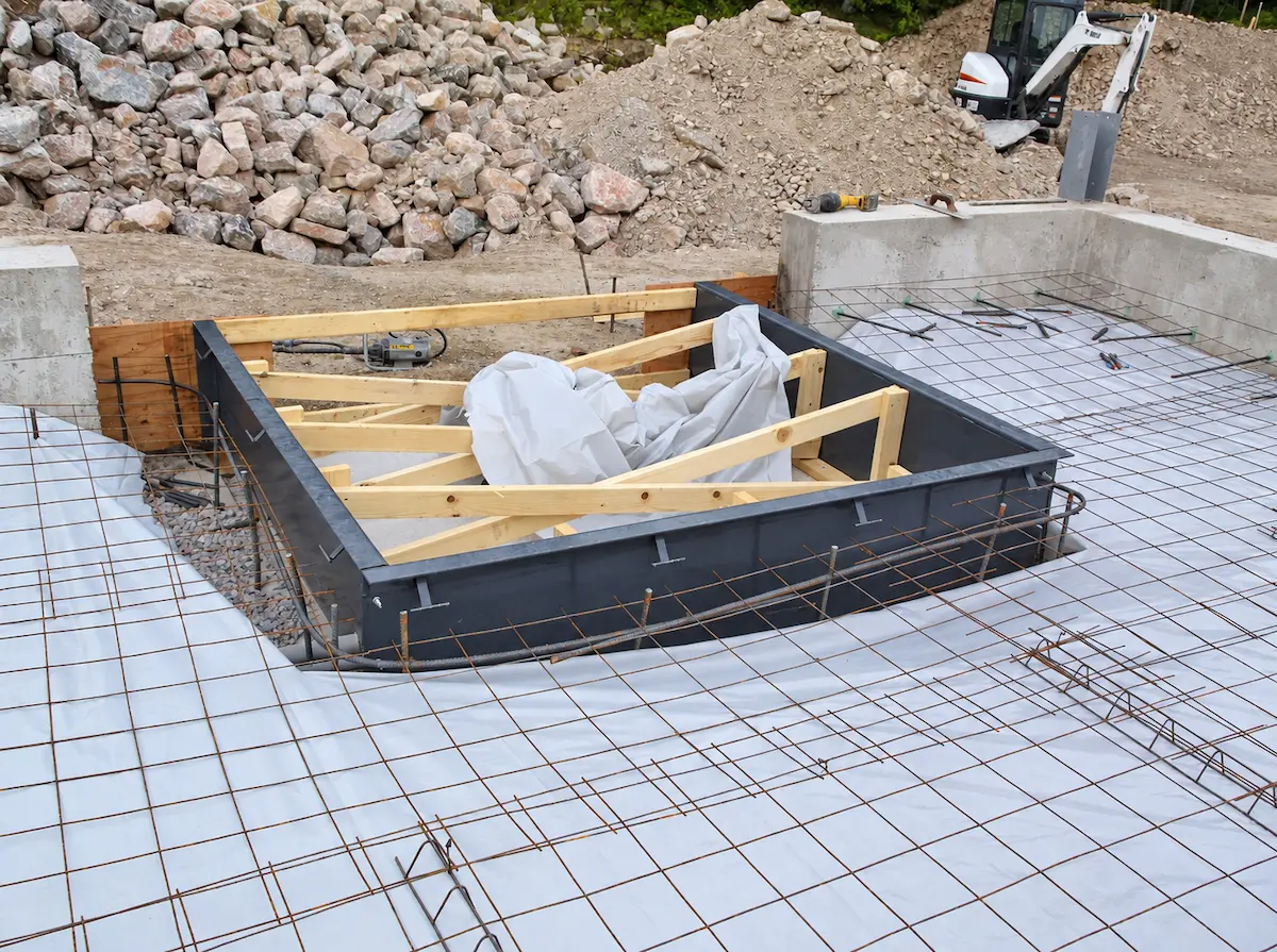 Reinforced concrete slab preparation for a post-frame building
